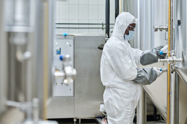 Engineer controlling levers on equipment